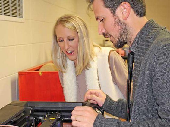 W Ansley Mays and GA Southern COE Rep Installing 3D Printer she won earlier this year