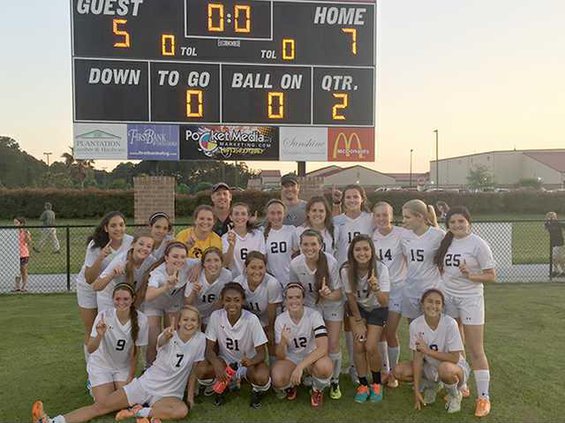 Team celebrates after a win. 