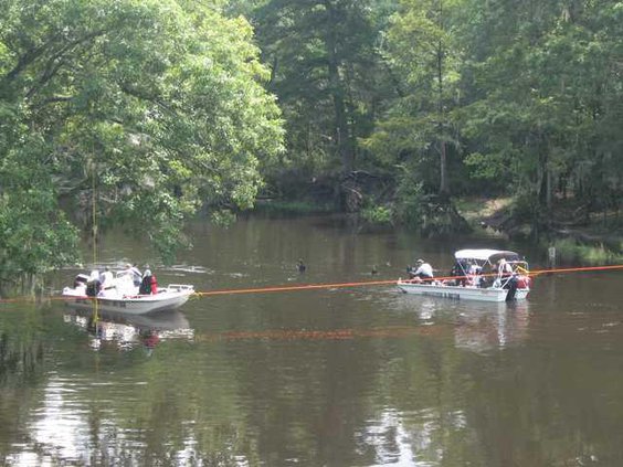 W Dive teams in river