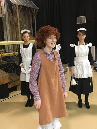 Hannah Sahr as Annie singing-I think I'm gonna like it here-with Cora McCullough & Rachel Gregory.jpg