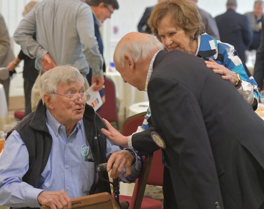 After being named 2021 Citizen of the Year by the Rotary Clubs of Statesboro, Dr. Henry "Jack" Proctor, left, and wife Beverly are congratulated by former recipient Bill Perry at Forest Heights Country Club on Monday, March 1.