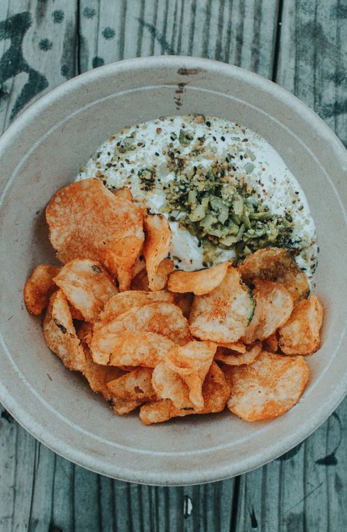 Labneh, dukkah, green olives, and Zapps chips.