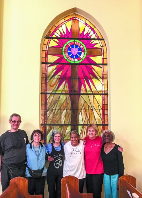 Senior yoginis Alan and Phyllis Boulton, Betsy Strong, and Georgette Battleand practice all kinds of asanas as the Saints & Sages most Wednesdays at Butler Presbyterian Church