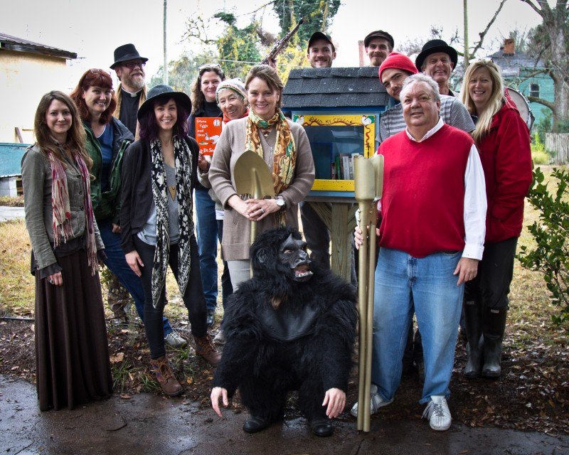 Friends of newlyweds Francis Allen and Leslie Lovell (r. and l. of the gorilla) helped dedicate the first FOC Little Free Library.