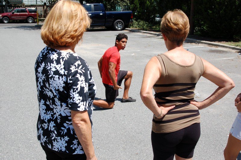 Personal trainer and CRI Life Enhancement Program Core Team member Palmer Steverson demonstrates proper body positioning for lunges.