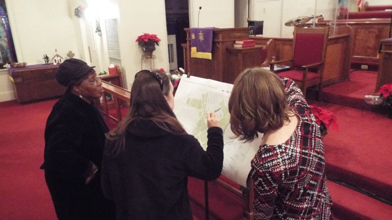 Members of the Sandfly community inspect a map of the proposed Sandfly Historic District at a community meeting at Speedwell UMC.