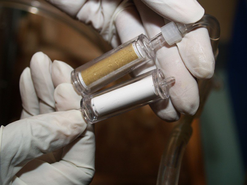 Water filters, before and after they have been used to filter particulates and microbes from a water sample.