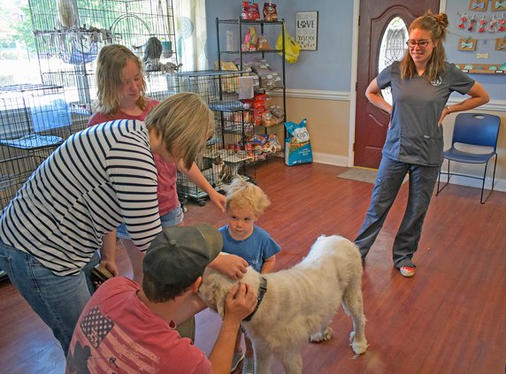 roehm with dog and family