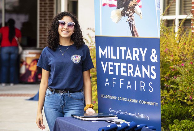 A Georgia Southern student works at a Veterans booth on the university's Liberty campus.