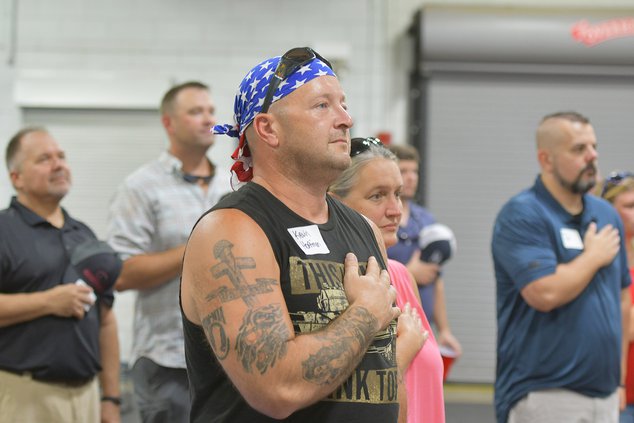 Sgt. First Class Kevin Hoffman, who served in Afghanistan with the 48th Brigade Special Troops Battalion, stands at attention for the National Anthem as Georgia Army National Guard veterans from units that deployed to Iraq and Afghanistan out of the State