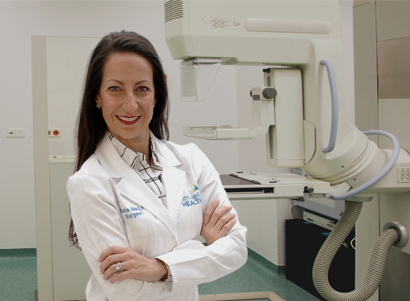 Dr. Jillard with a mammography unit.