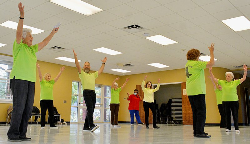 Thelma Kilpatrick, left, makes sure every dance has a big finish during a session at the Luetta Moore Building.