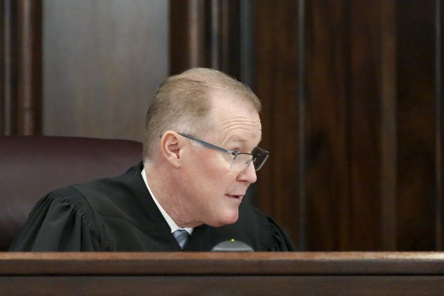 Judge Timothy Walmsley reads and explains the charges to the jury during the trial of William "Roddie" Bryan, Travis McMichael and his father Gregory McMichael, all charged with the February 2020 death of 25-year-old Ahmaud Arbery, Tuesday at the Glynn Co