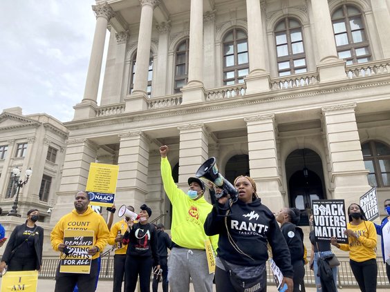 Protesters call on Georgia lawmakers to reject further changes to state voting laws on Tuesday, March 15, 2022, outside the state capitol in Atlanta. House members later approved a bill making numerous changes, sending it to the state Senate for more deba