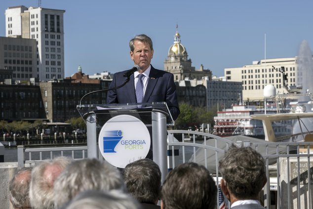 In this photo provided by the Georgia Ports Authority, Georgia Gov. Brian Kemp speaks at a ceremony marking completion of the Savannah Harbor deepening, Friday, March 25, 2022, in Savannah, Ga. Deepening the Savannah Harbor to 47 feet at mean low water (t