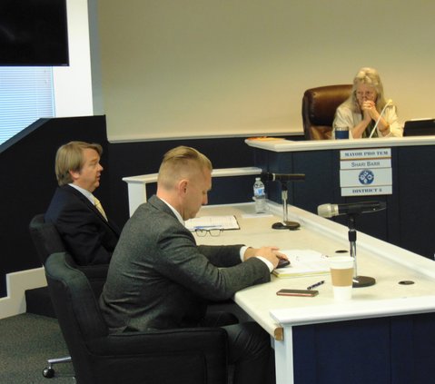 City Attorney Cain Smith, left, speaks during the Tuesday, April 5, 2022 Statesboro City Council meeting, where he advised the elected officials not to engage in outside conversations about the potential approval or denial of liquor store applications bec