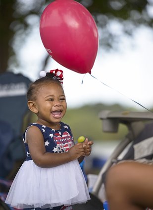 In this file photo, Khloee Major of Statesboro is all smiles while enjoying some grapes during the annual Firecracker Fest at Mill Creek Park. The 2022 Firecracker Fest is set for Sunday at Mill Creek Park.