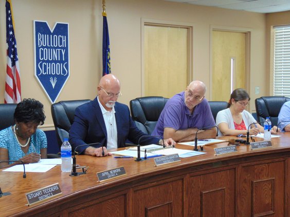 Superintendent Charles Wilson, second  from left, tells Bulloch County Board of Education members Thursday that a rollback of the school property tax millage rate sufficient to avoid tax increase hearings is impossible without giving up more than $5 milli