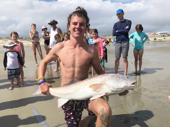 Emory D'Archangelo shows off the redfish he caught at the Tybee Island Redfish Tournament held Oct. 8. The fish was big enough to earn him first place in the Youth Division of the tournamet and a $1,000 check.