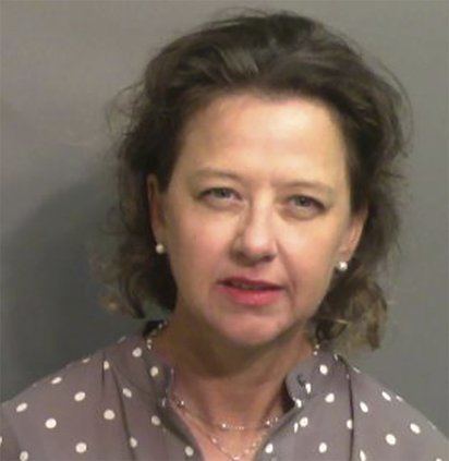 This booking photo provided by Glynn County, Ga., Sheriff's Office shows Jackie Johnson, the former district attorney for Georgia's Brunswick Judicial Circuit, after she turned herself in to the Glynn County jail in Brunswick, Ga, on Sept. 8, 2021. A judg