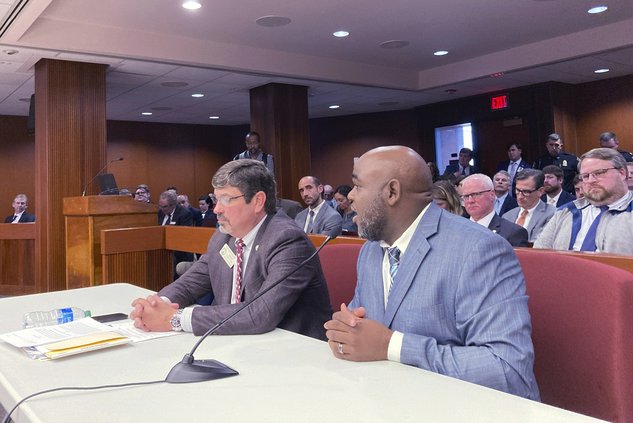 Logging company owner Toby McDowell of Locust Grove, Georgia, right, testifies in favor of higher weight limits on roads and bridges on Thursday, Feb. 9, 2023 at the state capitol in Atlanta. An industry-backed bill would raise truck weight limits in Geor