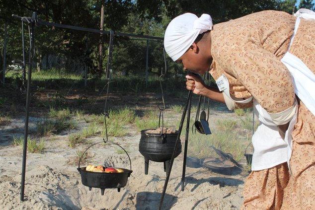 Food historian Clarissa Clifton, seen here cooking on the Willow Hill Heritage & Renaissance Center campus during a 2014 event, is one of several experts who will prepare meals during the" Taste of Struggle" event Saturday. (Photo courtesy of Willow Hill