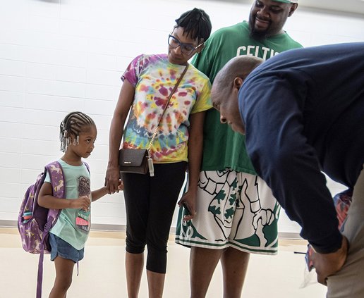 Mattie Lively Elementary School principle Al Dekle, right, welcomes new Pre-K student Zoey Key, 4, and parents Terry and Marquita during the first day of the new school year on Monday, August 1.