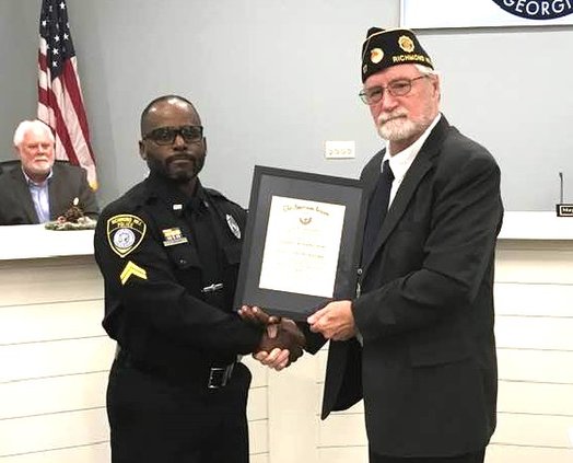 CPL Quinn receives Officer of the Year Award from CDR Awtrey.