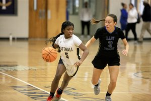 Jayla Calhoun, #5, taking the ball down the court for the Lady Warriors