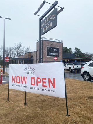 Jim 'N Nick's Community Bar-B-Q restaurant on Highway 80 East, next to Harbor Freight, officially opened to the public Wednesday with a ribbon-cutting ceremony.