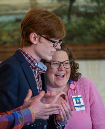 Statesboro High 's Eli Compton gets a squeeze from his STAR teacher Ashley Thompson as he is announce as the winner of the 2024 Bulloch County STAR recognition hosted by the Rotary Club of Statesboro at Forest Heights Country Club on Wednesday, Jan. 31.