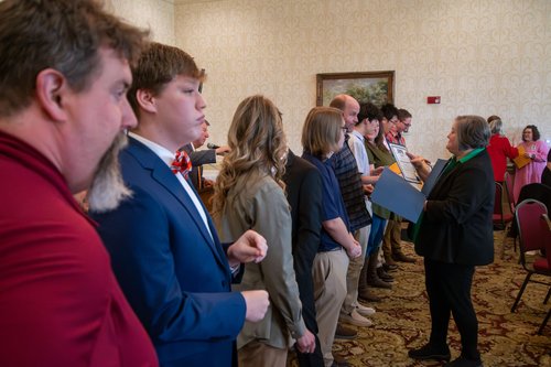 Bulloch County Schools Director Public Relations Hayley Greene, right, passes out certificates to all of the STAR students and teachers after their recognition hosted by the Rotary Club of Statesboro at Forest Heights Country Club on Wednesday, Jan. 31.