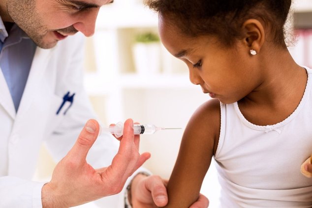 girl getting vaccine
