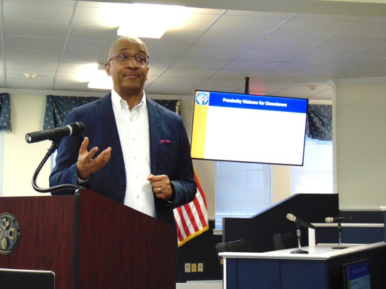 During a March 26 information meeting, City Manager Charles Penny explains the proposed ordinance change exempting an area of downtown Statesboro from the 100-yard distance requirement between alcohol pouring establishments and churches and certain other