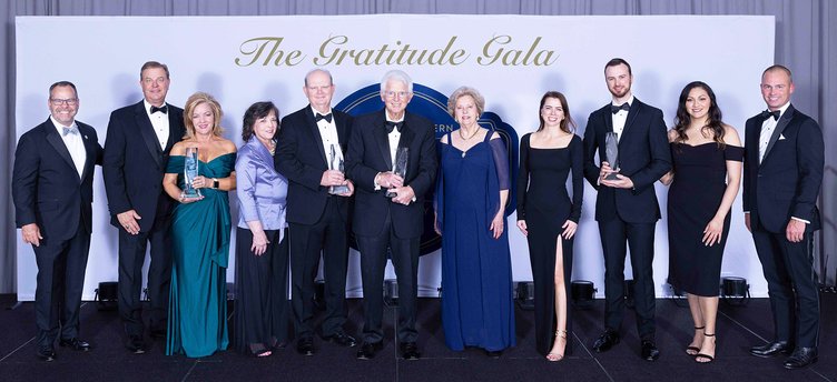Pictured, left to right, Georgia Southern President Kyle Marrero, Darron Burnett, Kim Powell, DeNorah Huggins, Walt Huggins, Dr. Dennard L. Scoggins, Wanda B. Scoggins, Stephanie Sanders, Robbie Sanders, Maria Sanders and Georgia Southern VP of University