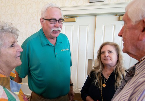 Don Poe and wife Mary are congratulated by Bulloch County Commission Chairman Roy Thompson and his wife Deborah after Poe is honored.