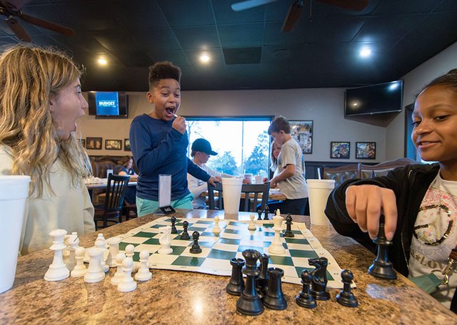 Chess & Pizza draws monthly crowd to Holiday Pizza