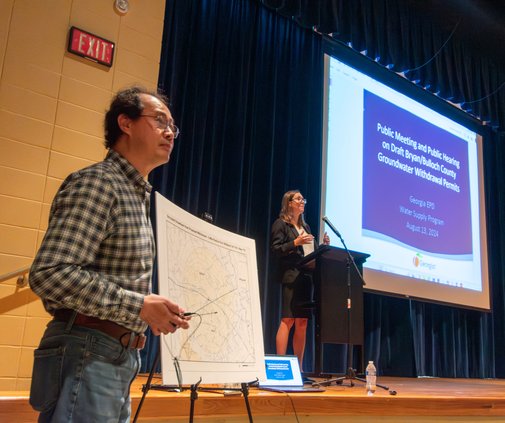 Water Supply Program Manager Wei Zheng, left, and Watershed Protection Branch Chief Anna Truszczynski of the Georgia Environmental Protection Division kick off the public meeting on Hyundai wells at Southeast Bulloch High School on Tuesday, August 13.
