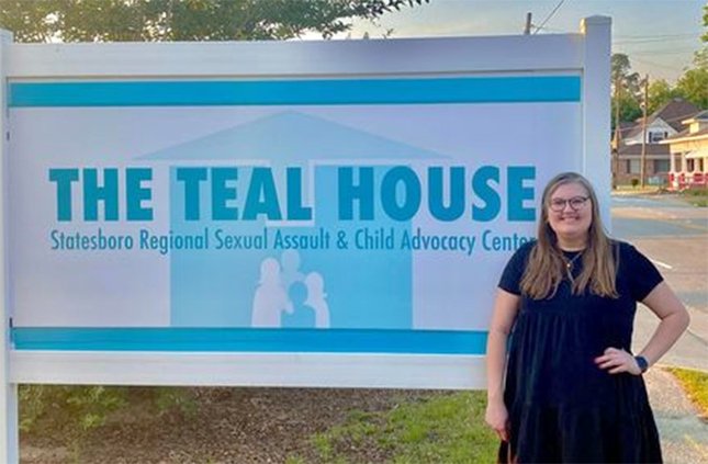 Photo courtesy The Teal House Executive director Lily Gray is shown in front of The Teal House on South College St. Gray is inviting people to an open house at the agency on Sept. 26.