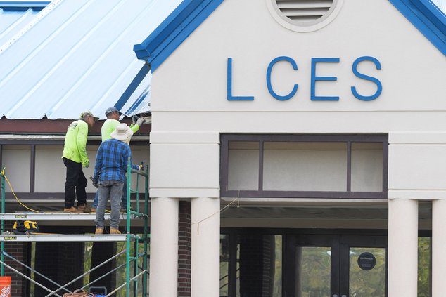 Langston Chapel Elementary School gets some roof repairs as Statesboro and Bulloch County continue to cope with the effects of Hurricane Helene on Tuesday, Oct. 1. Power has been restored to all local schools except for Stilson Elementary.