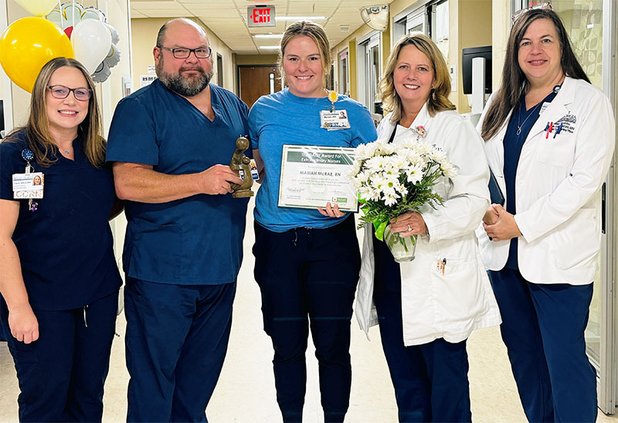 Mariah McRae, center, is shown with the nursing leadership team from East Georgia Regional Medical Center. McRae received the hospital's latest DAISY Award, which honors the top nurses at the hospital.