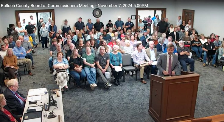 Image from Bulloch County Commission video Citizens fill the Bulloch County Board of Commissioners meeting room to overflowing Thursday, evening, Nov. 7, as attorney Chris Gohagan  stands at the lectern to give a developer's perspective on the first of ei
