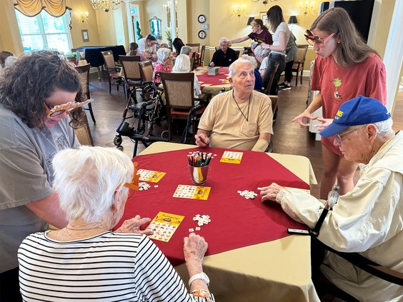 Photos by JASON MARTIN/special Statesboro High School senior Caroline Bland, at right, helps residents with a Thanksgiving Bingo game Saturday,  Nov. 9, at Willow Pond Assisted Living on Country Club Road. As part of her National Honor Society project, Bl