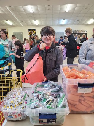 11-year-old Colton Bragg came out with his father to help pack the bags.