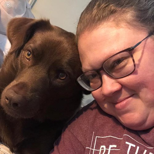 Laura Devisscher and her chocolate lab Bella.