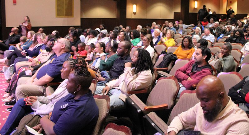 A diverse crowd from a diverse community, citizens occupy most of the ground floor seats at the Emma Kelly Theater at the Averitt Center for the Arts for the mayor's speech.