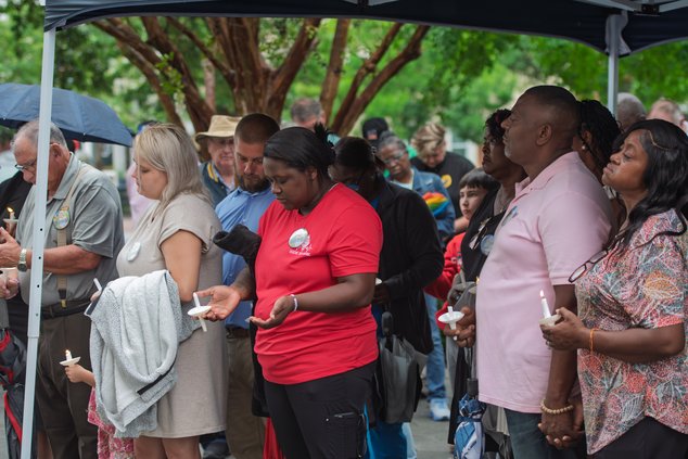 The families of 4-year-old Landyn Wilkerson and 9-year-old Emily Grace Mayo bow their heads in prayer during a vigil hosted by the City of Statesboro at the Bulloch County Courthouse Wednesday, June 4, honoring the lives of the two local children who trag