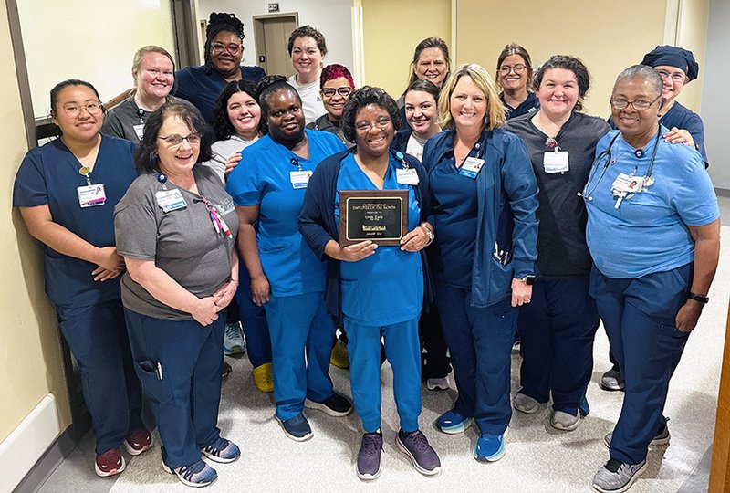 Photo Courtesy East Georgia Regional Medical Center Linda Curry, center holding plaque, is shown with the medical surger team at East Georgia Regional Medical Center after being named Employee of the Month for January.