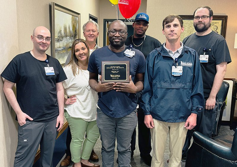Photo Courtesy East Georgia Regional Medical Center Sterling Irvin, center holding plaque, is shown with thesupply chain team at East Georgia Regional Medical Center after being named Employee of the Month for February.