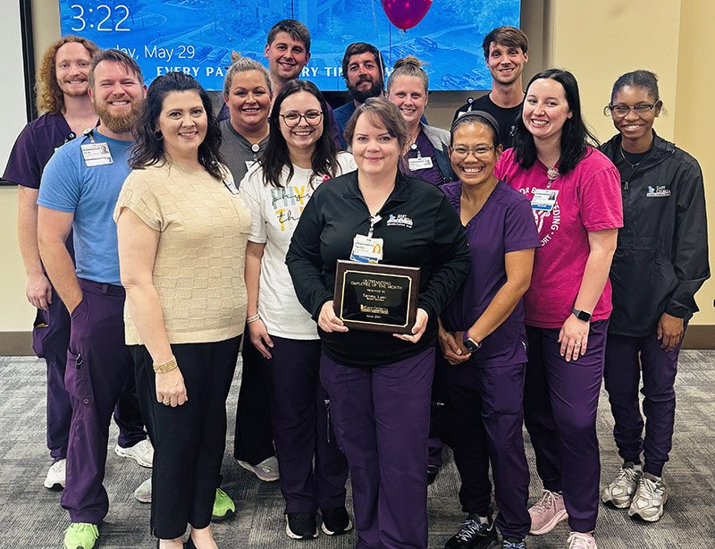 Photo Courtesy East Georgia Regional Medical Center Tammy Lynn, center holding plaque, is shown with the rehabilitation team at East Georgia Regional Medical Center after being named Employee of the Month for March.